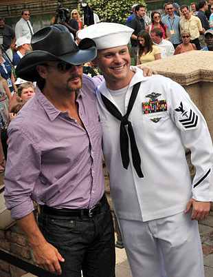 Tim McGraw with sailor on Military Appreciation Day
