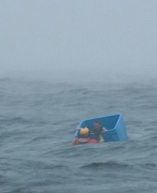Ocean survivor floats in crate-Joel Brady-Power
