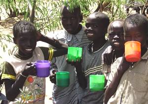 African kids with water cups
