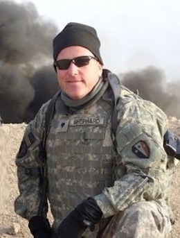 Soldier in Iraq poses family photo