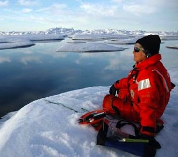 Sue Moore listens for bowhead whales - NOAA photo