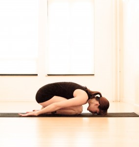 Childs Pose yoga pose via Gaiam.com