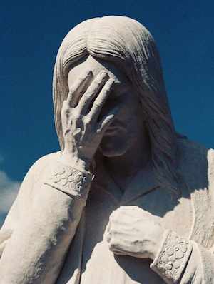 crying statue by taliesin-morguefile-cc