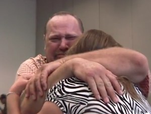Hugs during history-making auction