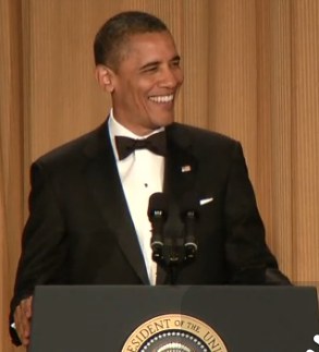 Obama laughs podium