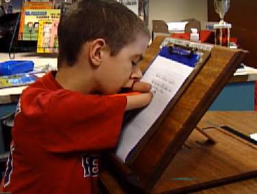 boy with no hands aces penmanship (WCSH video)