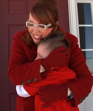 Kelee with Charlie, a recipient of a Design Gives Back Miracle Makeover