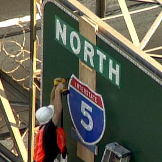 freeway-guerilla-sign-catherine-cummings.jpg