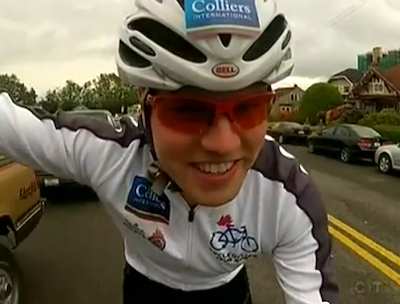 Cyclist rides neighborhood streets-CycleofLifeTour-photo