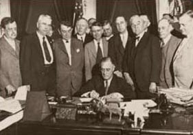 Franklin Roosevelt signs the TVA Act