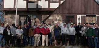 Construction crew poses outside home-HollisterCo