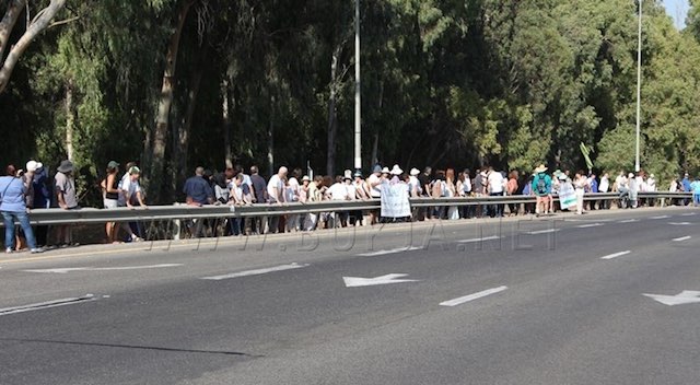 Givat Haviva-line-of-peace-demonstrators-FB-watermark-bukjaDOTnet