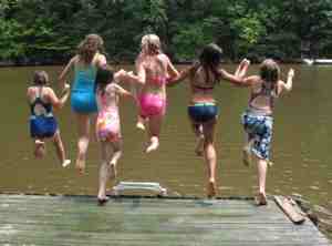 girls-jumping-lake.jpg