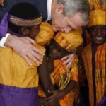 bush-embraces-african-choir.jpg