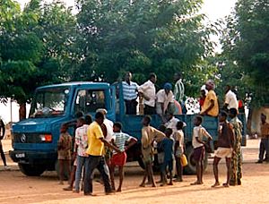 villagers waiting with a truckload, USAID photo