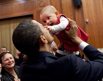 President Obama hoists a baby - WH photo