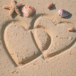 hearts in sand sun - Photo by Sun Star