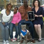 Steen family with pit bull that saved them from fire