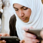 Apps For Good photo of Muslim girl with mobile phone