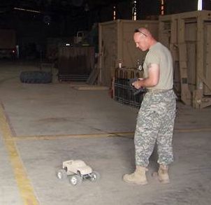 family photo of Chris playing w the truck