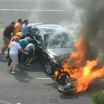 Motorcyclist under burning car - YouTube video