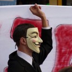 Occupy Wall Street mask in Paris demonstration by stanjourdan-cc