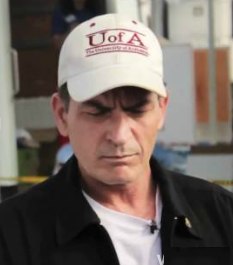 Charlie Sheen in Alabama hat, during tornado visit