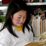 Child reading in Mongolia -Bookbridge photo