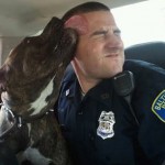 Dog licking police officer - familyphoto