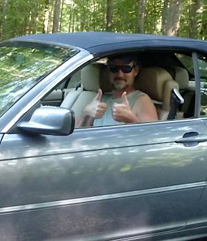 Car driver thumbs up