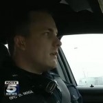 policeman in patrol car KCTV video