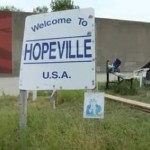 Hopeville welcome sign-InvisiblePeople-video