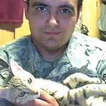 soldier Jesse Knott with feral Afghan cat