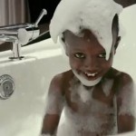 African boy gets bath - WATERisLIFE