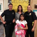 Policemen with school girl and new backpack-PPD