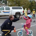 Police in Canada high five kids on bikes