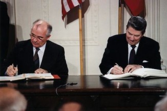 Reagan and Gorbachev signing treaty - WH photo