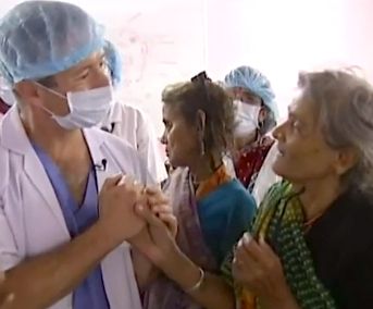 doctor Geoff Tabin comforts poor- from ITN video