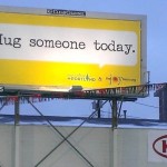Hug someone today billboard The JoyTeam
