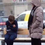 boy shivering on bench lady stands-YouTube