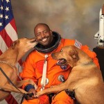 NASA-astronaut-Leland-D-Melvin-with-his-dogs-Jake-and-Scout-thumb-560x448