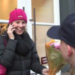 woman-gets-flowers-on-street-on-phone-submitted-NylonDotCom