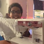 boy at sewing machine-Elliott Family FB