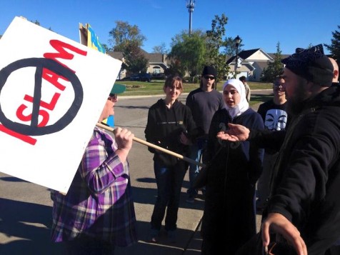 Muslim Woman Disarms Anti-Islam Protester With A Hug