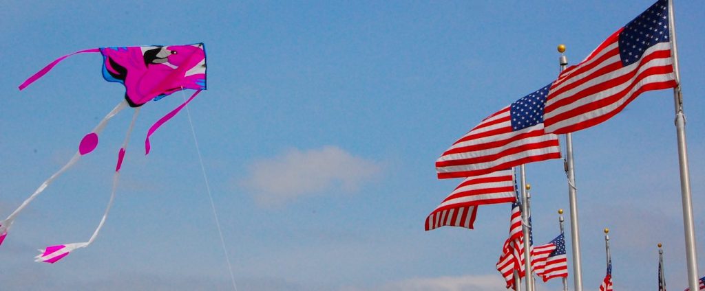 american-flags-and-kite-CC-Martha-Heinemann-Bixby-1024x424.jpg?profile=RESIZE_710x