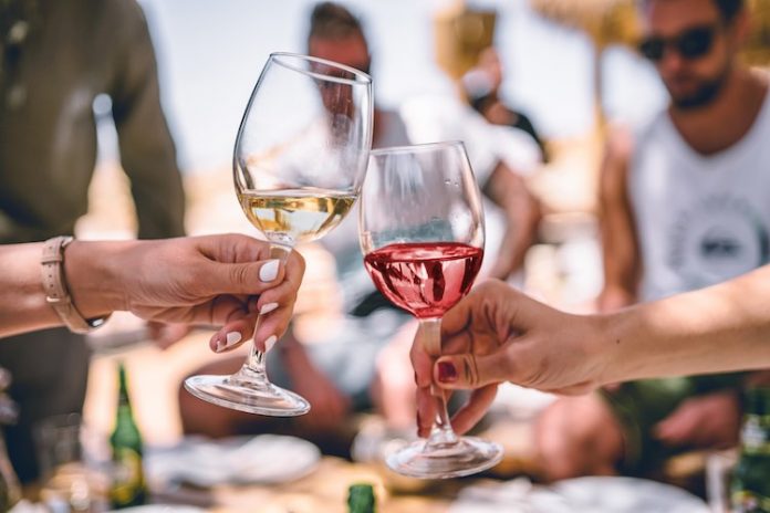 Cheering Wine Glasses-SWNS OnePoll