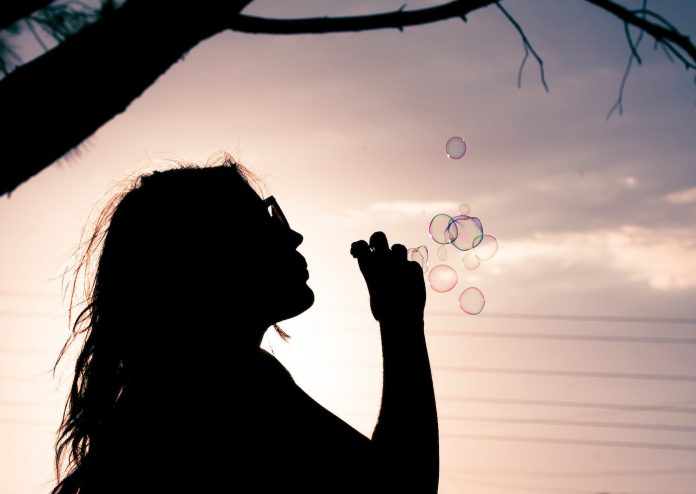 girl blows bubbles fun imagination-cc-Luis Hernandez