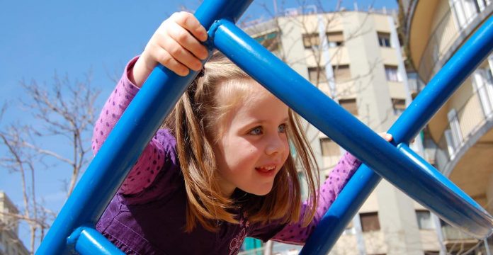girl climbing playground-cc-Joshua Zamrycki