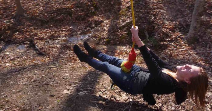 girl on rope swing-fun-silly-playful-nature-autumn-copyright-McKinley Claire