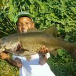 Watch This Young Fisherman Melt Hearts By Releasing the Biggest Fish He Ever Caught
